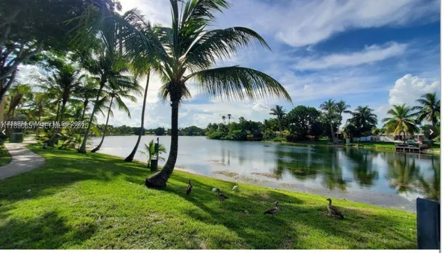 a view of a lake and a garden