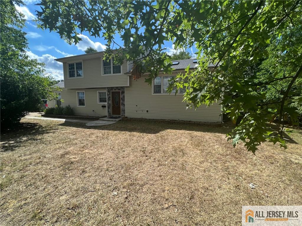 a view of a house with a tree