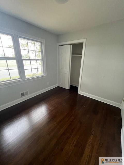 139 Rues Lane East Brunswick, NJ 08816 - Photo 10 of 17 an empty room with wooden floor and windows