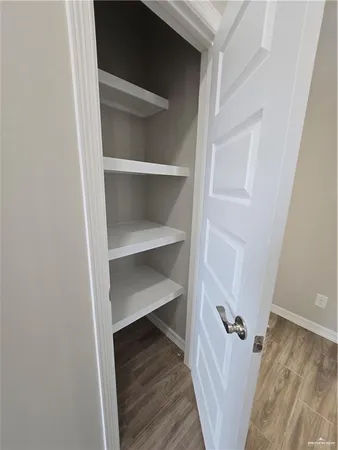 a view of closet area with empty racks