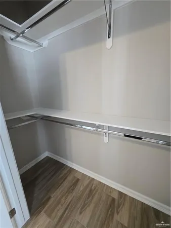a view of an empty walk in closet