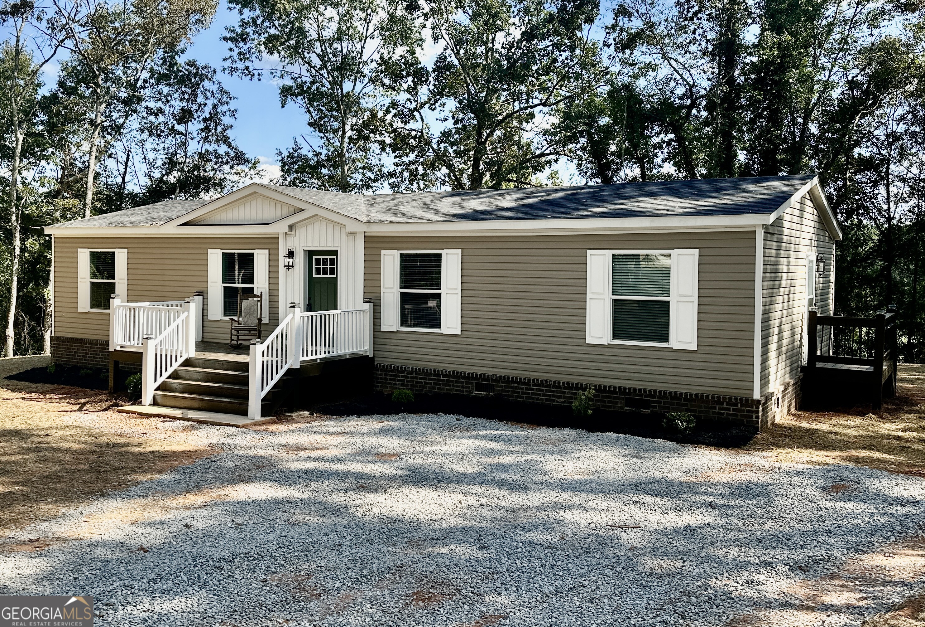 1052 Cannon Bridge Road Demorest, GA 30535 - Photo 1 of 1 a front view of a house with a yard