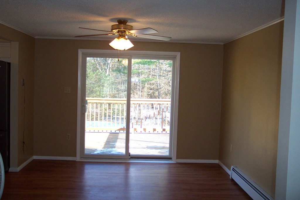 235 Turkey Hill Road Rutland, MA 01543 - Photo 3 of 9 a view of an empty room with wooden floor and a window