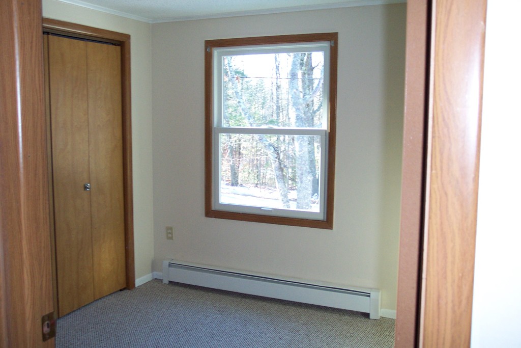 235 Turkey Hill Road Rutland, MA 01543 - Photo 9 of 9 a view of an empty room and a window
