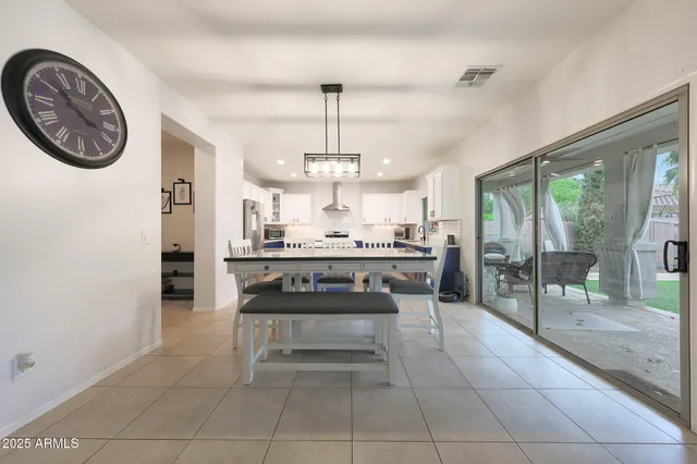 a kitchen with stainless steel appliances granite countertop a stove and a cabinets