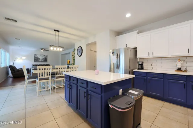 a bedroom with a bed and a tv on the dresser
