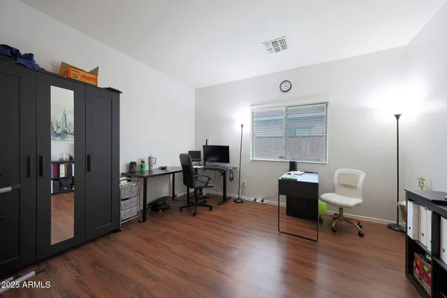 a view of a workspace with furniture