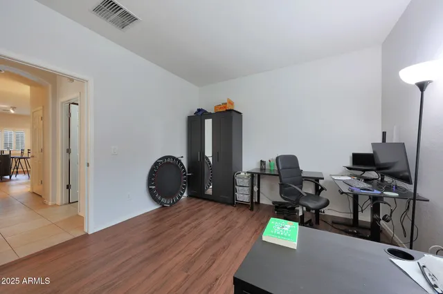 a bedroom with a bed and a dresser