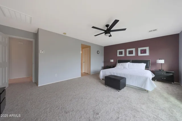 a view of a house with swimming pool and sitting area