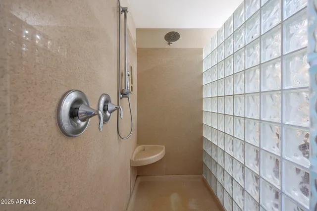 a view of a house with swimming pool and sitting area