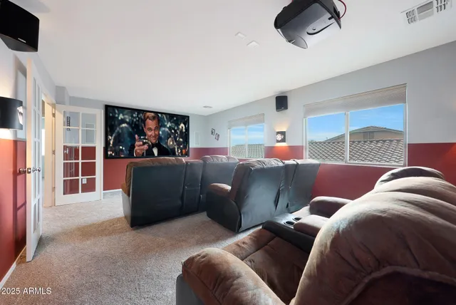 a view of house with backyard and furniture