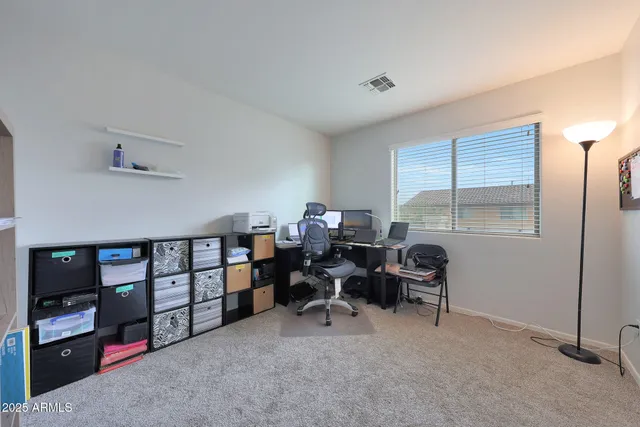 an aerial view of multiple houses with yard