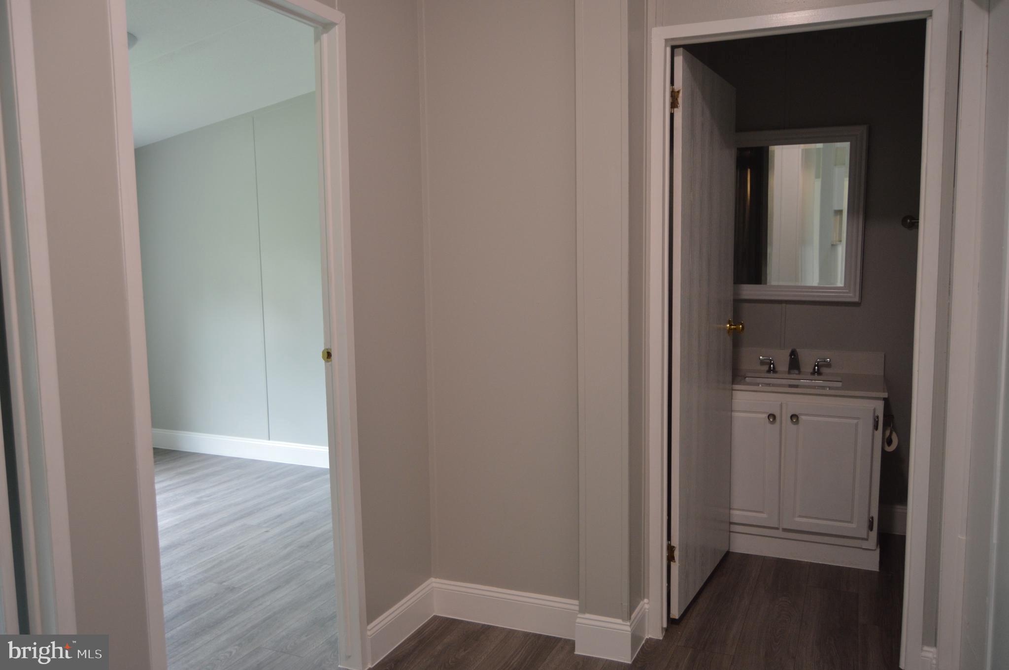 19286 Courtney Road Hanover, VA 23069 - Photo 13 of 23 Hall bath is centrally located between 3 bedrooms
