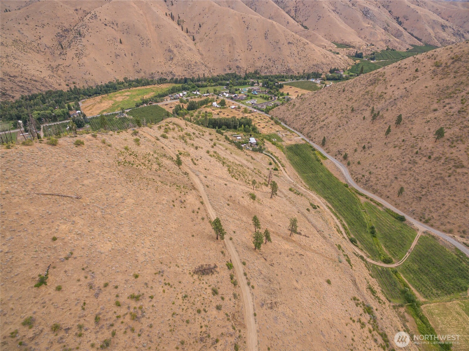 5058 Mills Canyon Road Entiat, WA 98822 - Photo 22 of 25 a view of a dry yard with wooden fence