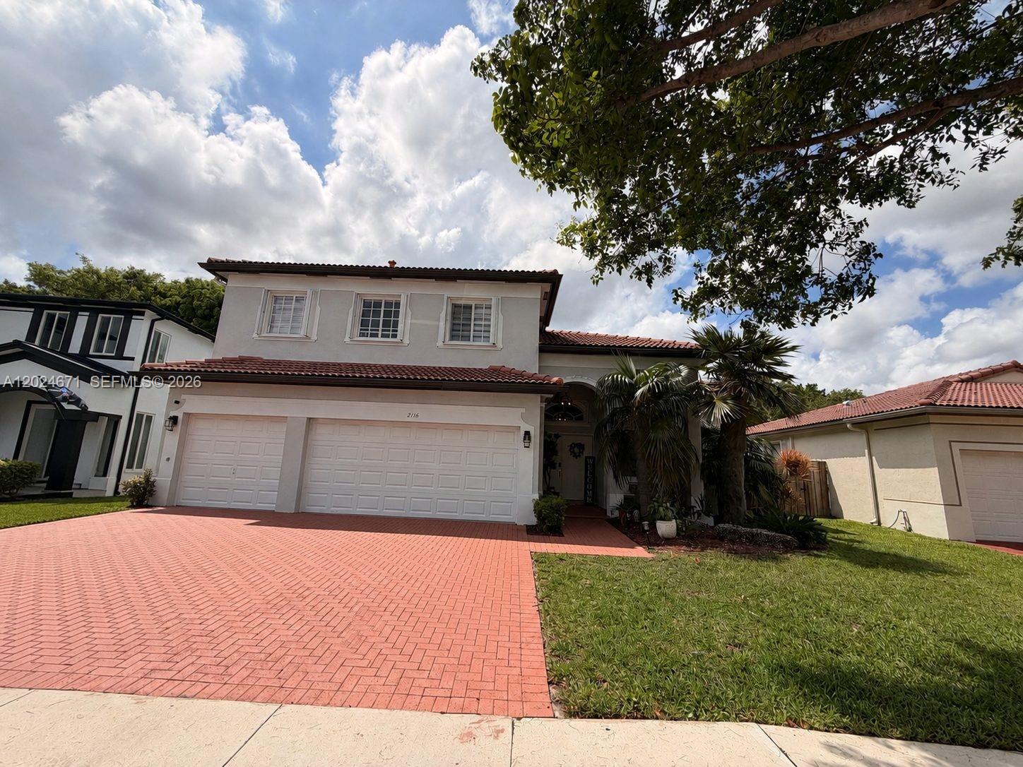 2116 Northeast 38th Road, Unit 2116 Homestead, FL 33033 - Photo 1 of 31 a view of house and outdoor space
