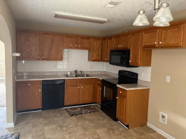 136 St Ann Circle Dallas, GA 30157 - Photo 13 of 44 a kitchen with a sink a stove top oven and cabinets