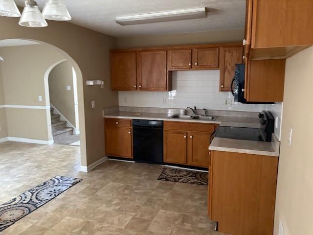 136 St Ann Circle Dallas, GA 30157 - Photo 14 of 44 a kitchen with a sink stove and cabinets