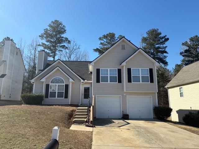 136 St Ann Circle Dallas, GA 30157 - Photo 2 of 44 a front view of a house with a yard