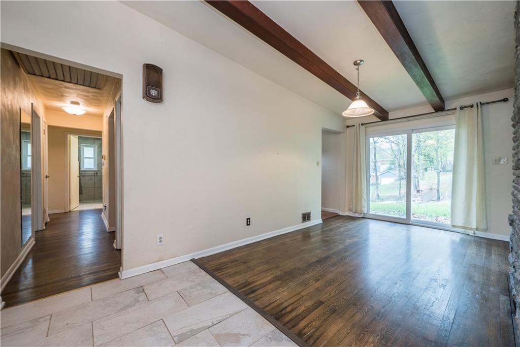 3431 Evergreen Road Pittsburgh, PA 15237 - Photo 8 of 50 a view of an empty room with wooden floor and a window