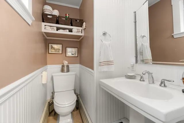 a bathroom with a sink a toilet and vanity