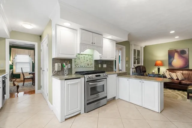 a kitchen with stainless steel appliances granite countertop a sink and cabinets