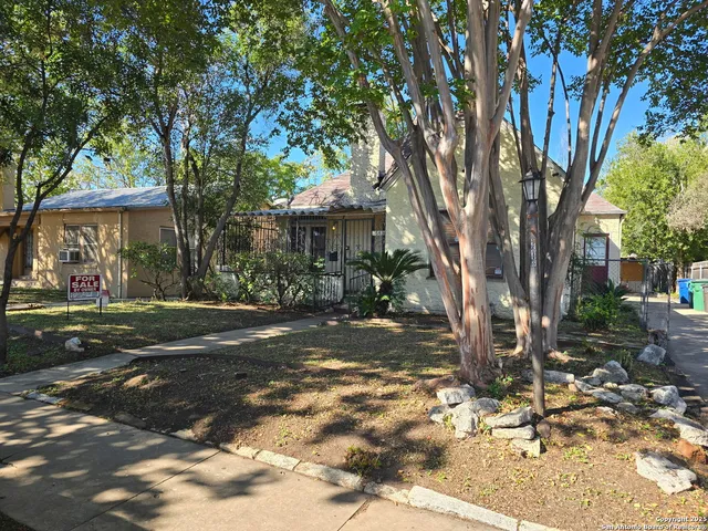 a view of a trees in front of a house