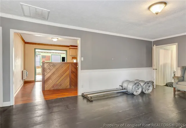 a view of a livingroom with wooden floor