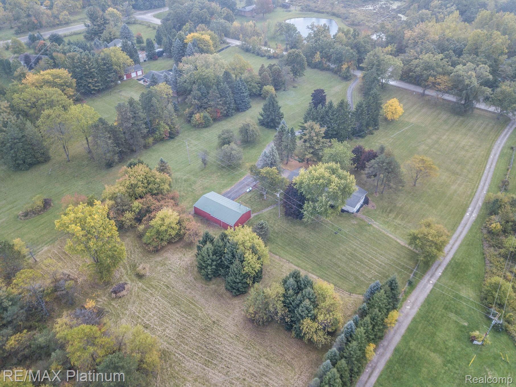 7799 Golf Club Road Howell, MI 48843 - Photo 38 of 38 Pole Barn and property behind pole barn included