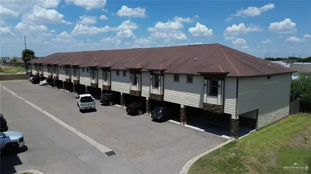 an aerial view of house with yard