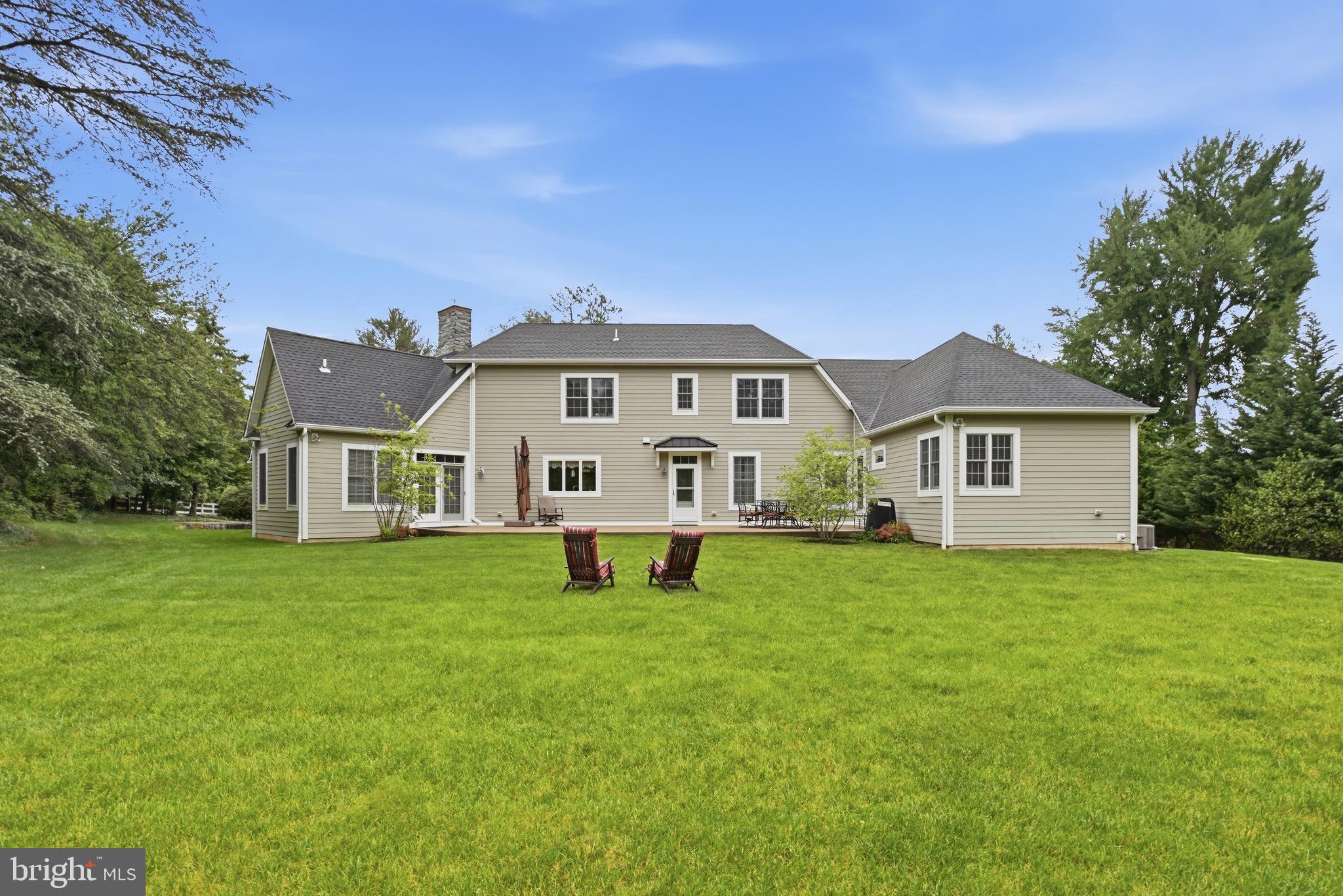 1031 Coates Road Jenkintown, PA 19046 - Photo 51 of 66 a view of a house with a big yard and large trees