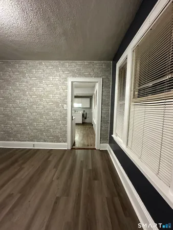 a view of wooden floor in a kitchen