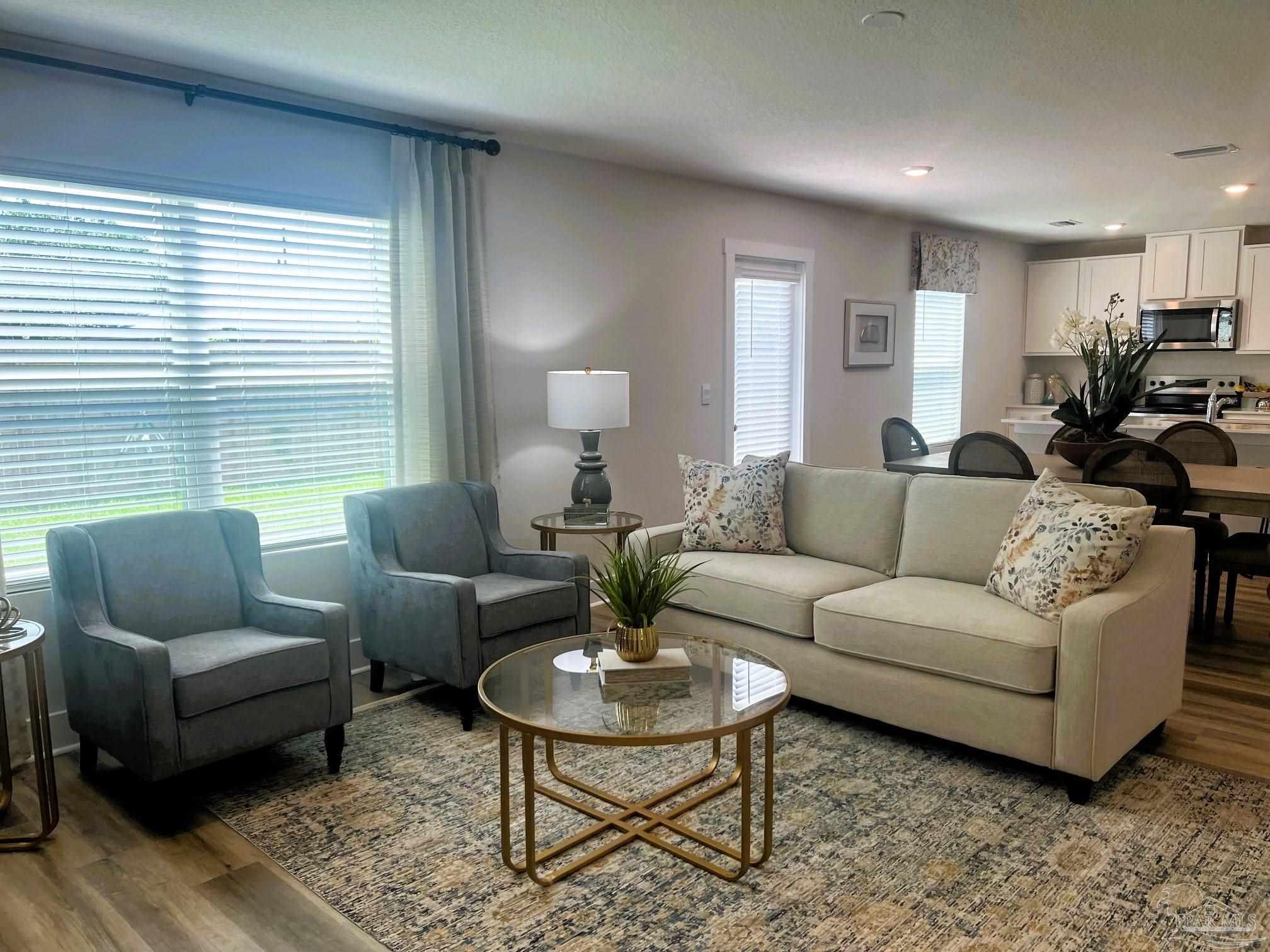 4932 Valor Court Pace, FL 32571 - Photo 3 of 5 a living room with furniture a table and a window