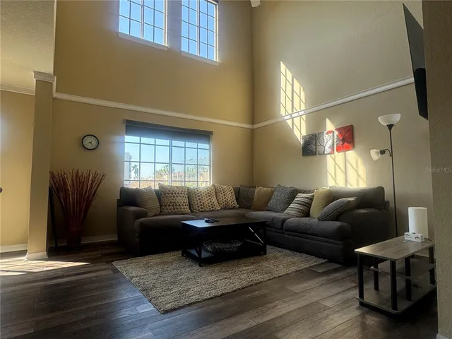 a living room with furniture and a window