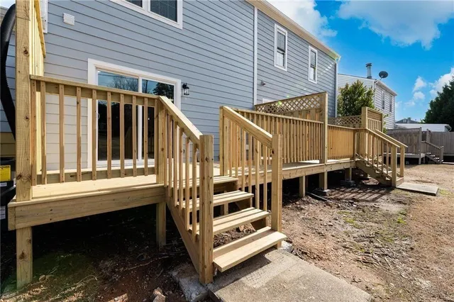 a view of a house with a balcony and door