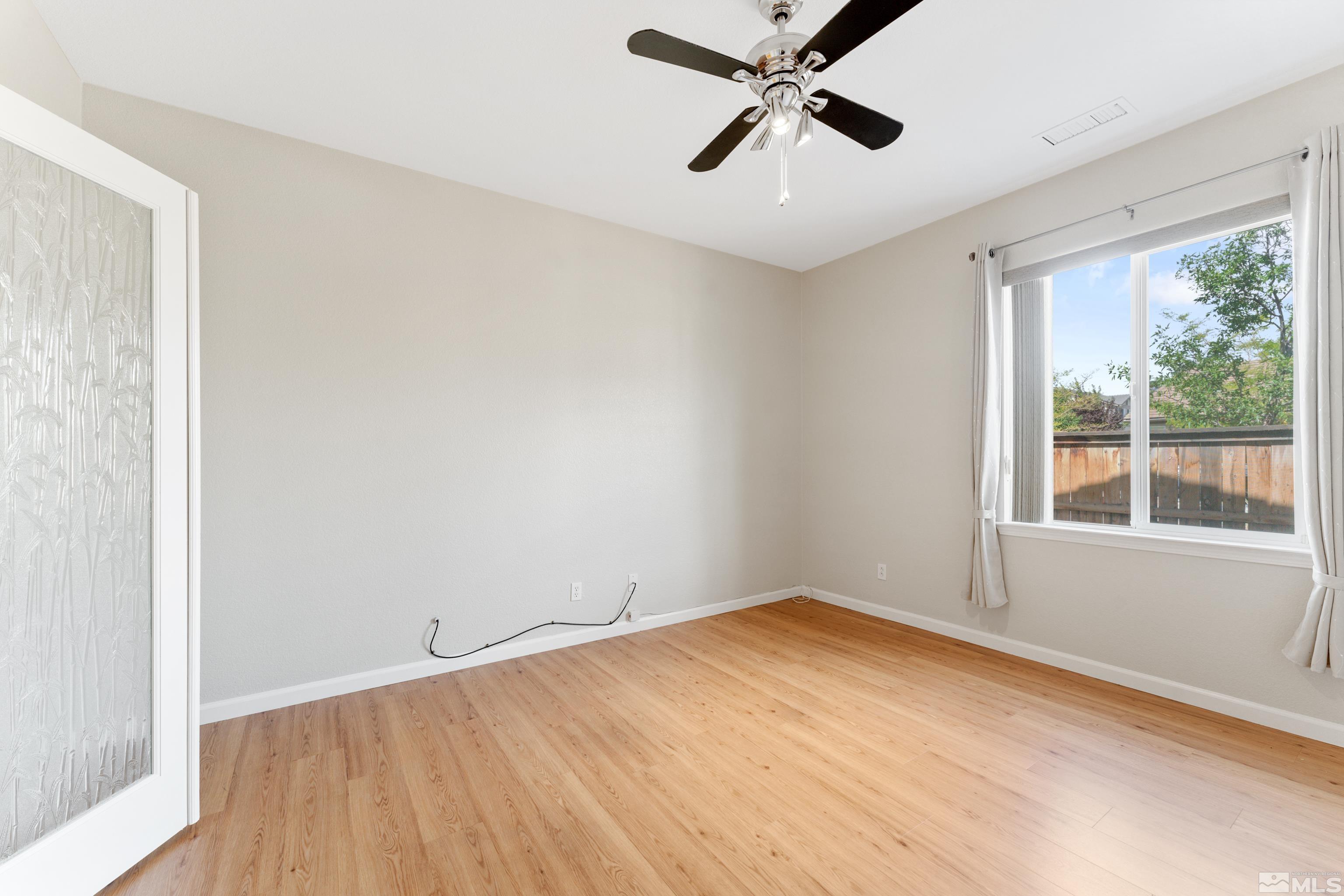 2195 Horse Prairie Road Reno, NV 89521 - Photo 14 of 39 a view of an empty room with a window