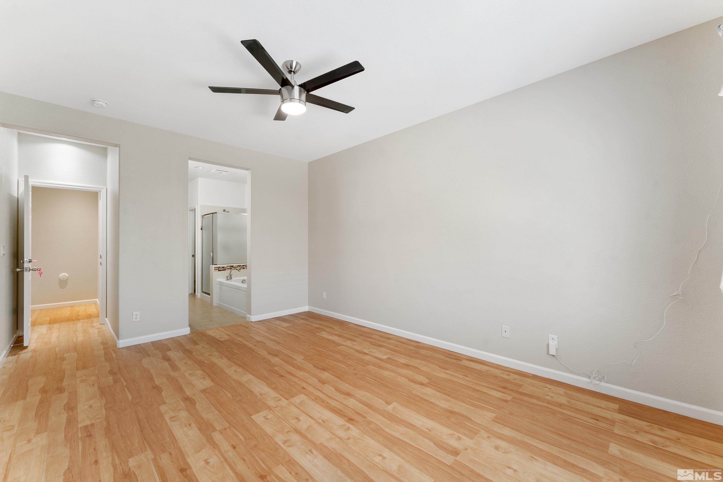 2195 Horse Prairie Road Reno, NV 89521 - Photo 20 of 39 a view of empty room with wooden floor