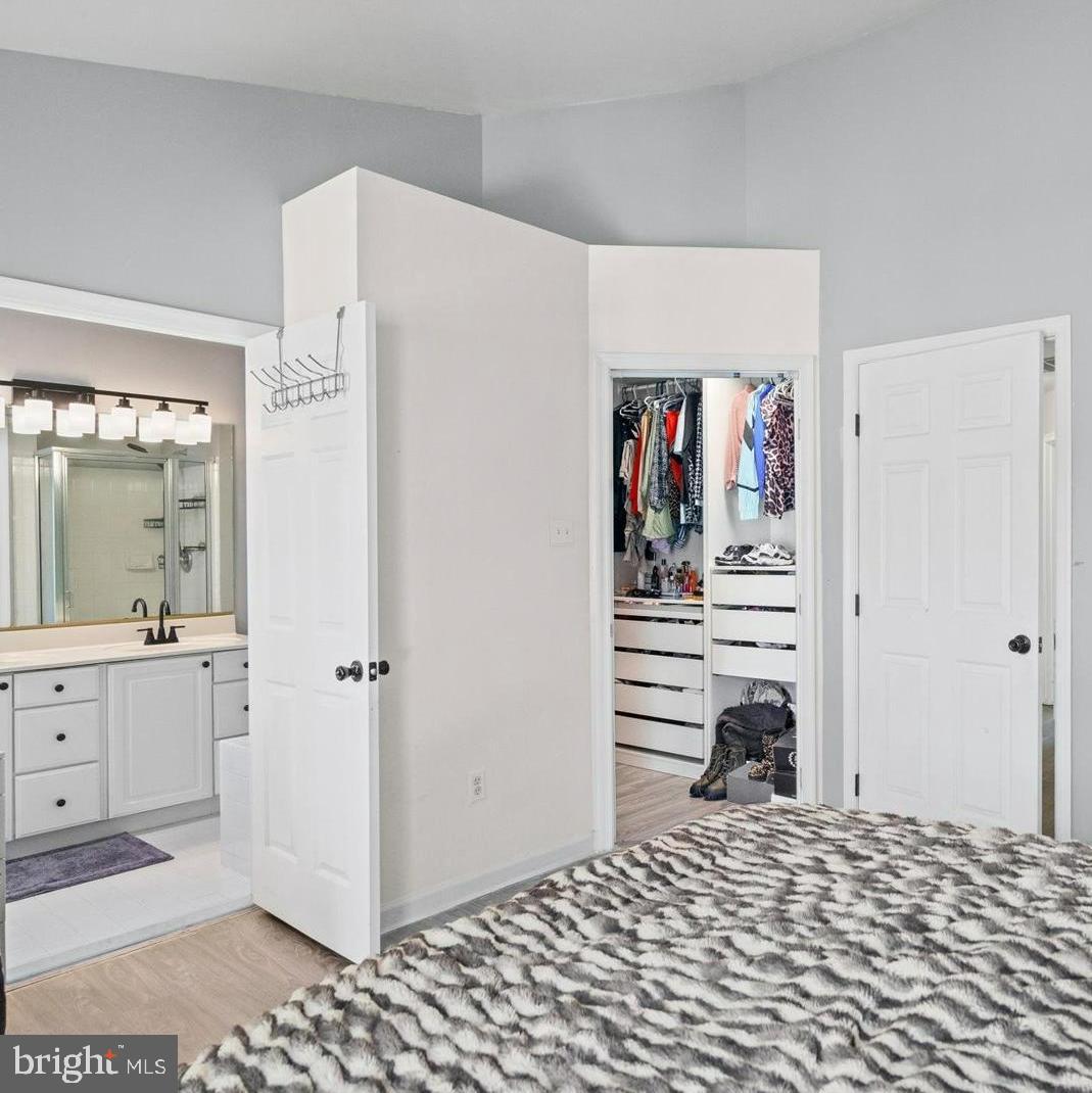 9965 Sherwood Farm Road Owings Mills, MD 21117 - Photo 12 of 35 a bedroom with a bed and a view of bathroom