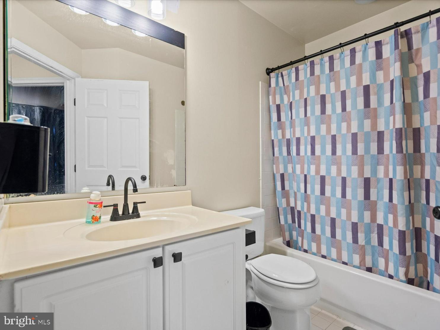 9965 Sherwood Farm Road Owings Mills, MD 21117 - Photo 17 of 35 a bathroom with a sink toilet and shower