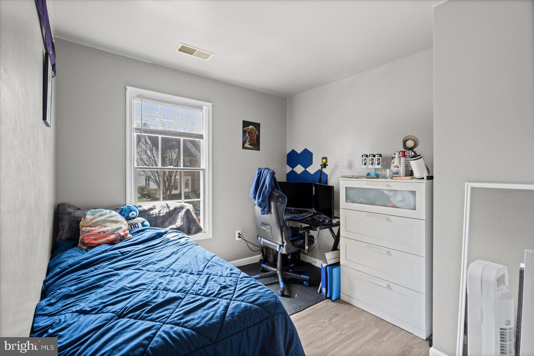 9965 Sherwood Farm Road Owings Mills, MD 21117 - Photo 18 of 35 a bedroom with a bed and a window