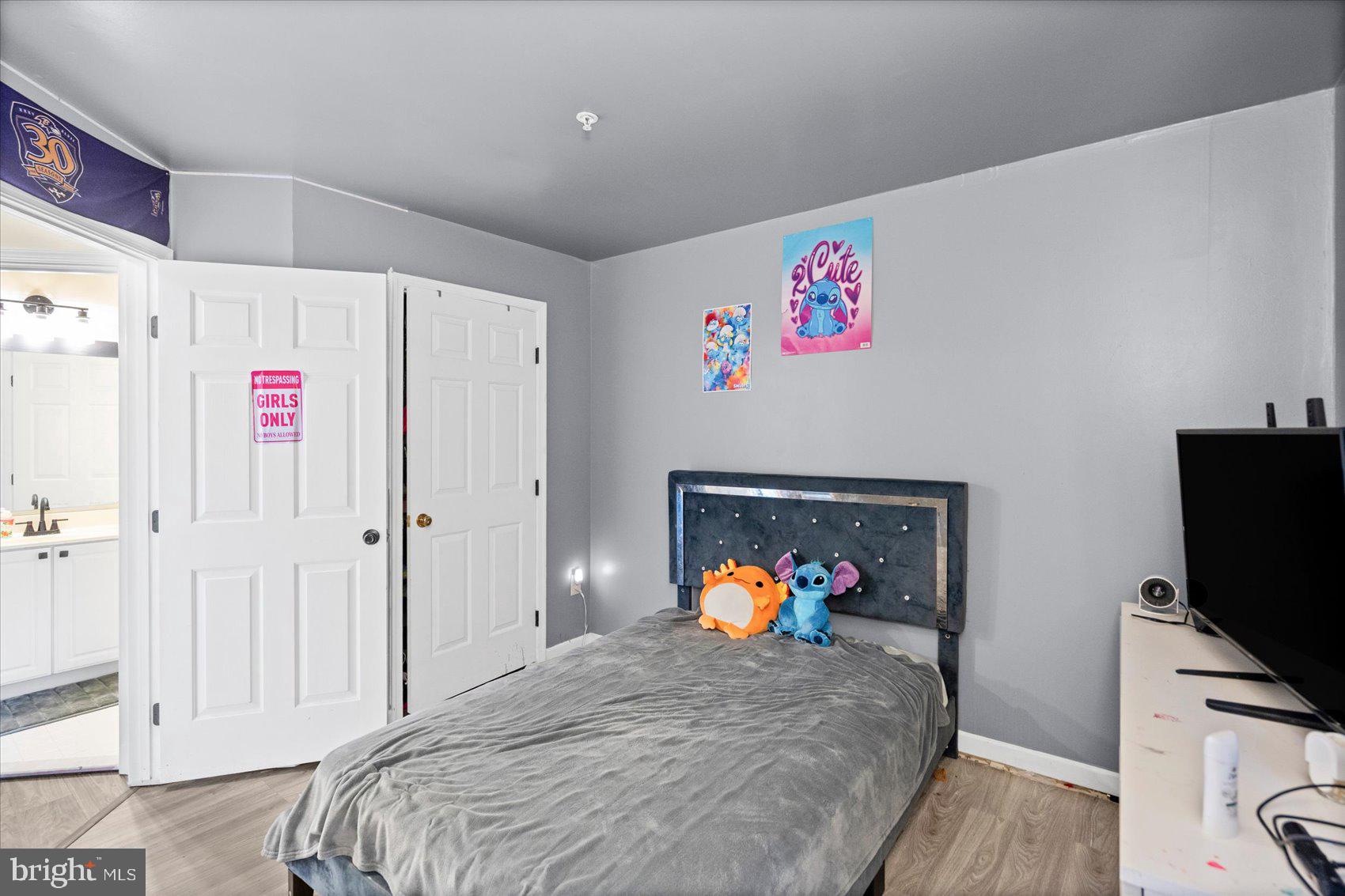 9965 Sherwood Farm Road Owings Mills, MD 21117 - Photo 20 of 35 a bed room with a bed and a television