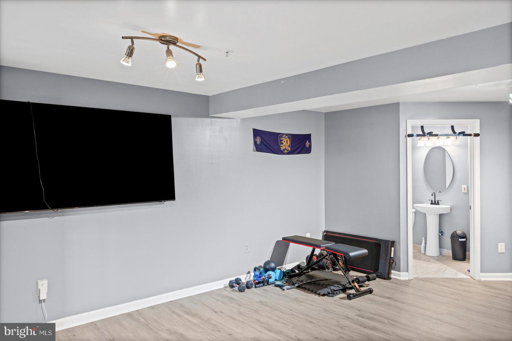 9965 Sherwood Farm Road Owings Mills, MD 21117 - Photo 24 of 35 a view of a room with gym equipment