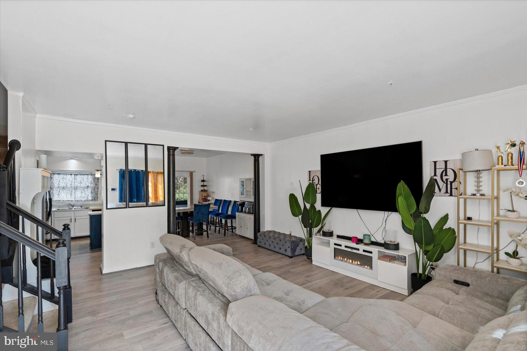 9965 Sherwood Farm Road Owings Mills, MD 21117 - Photo 4 of 35 a living room with furniture and a flat screen tv