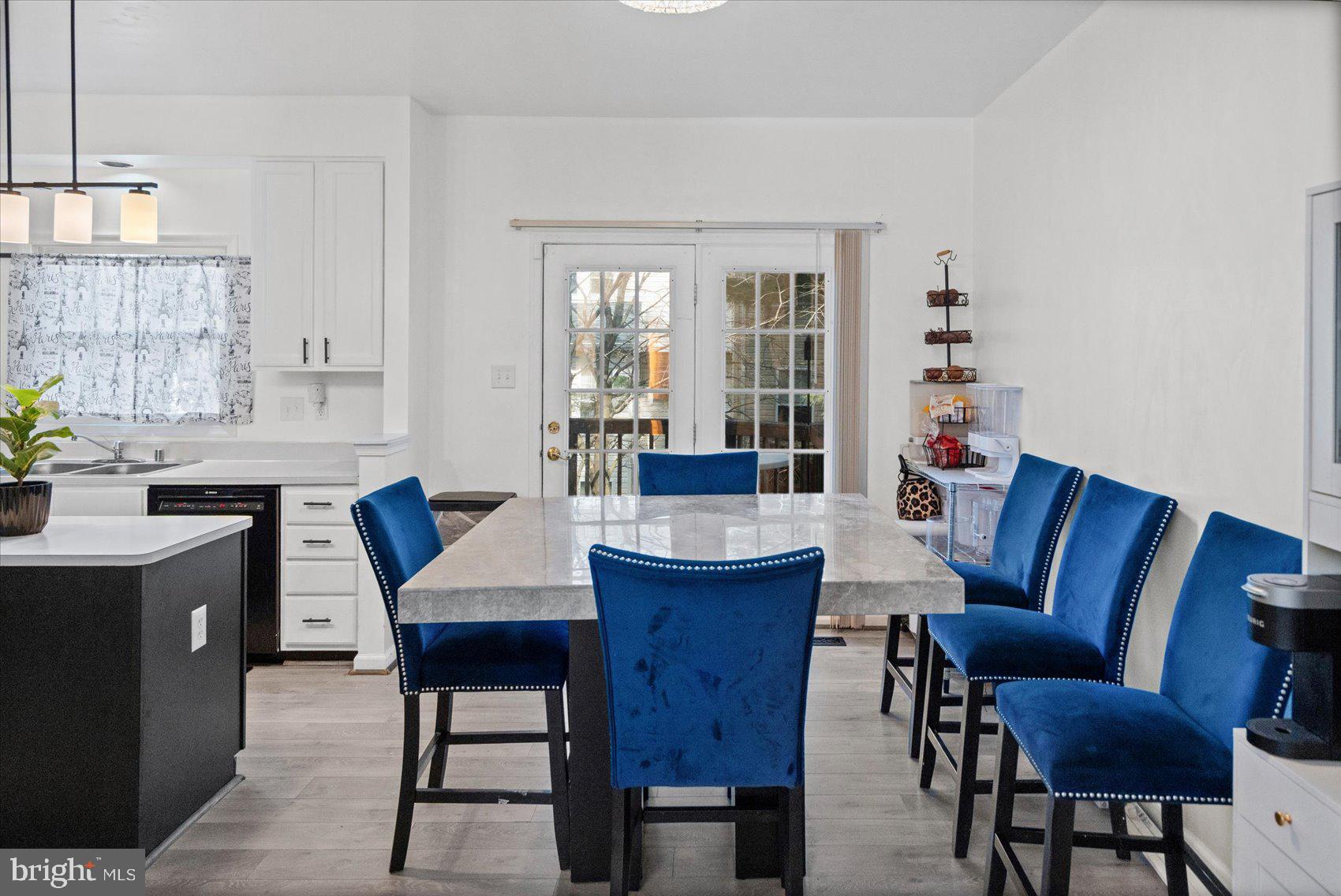 9965 Sherwood Farm Road Owings Mills, MD 21117 - Photo 10 of 35 a view of a dining room with furniture window and wooden floor