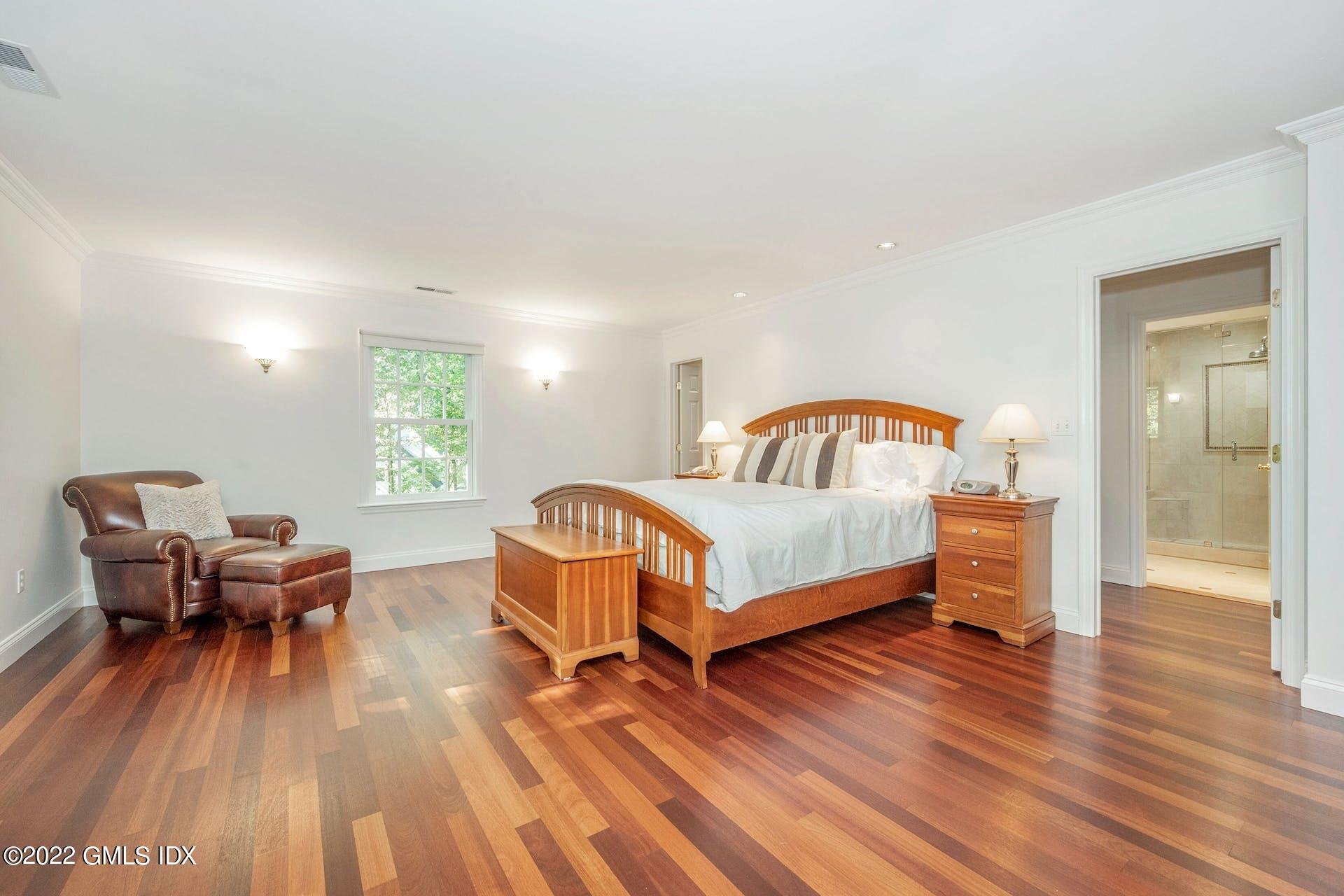 12 Frontier Road Cos Cob, CT 06807 - Photo 11 of 36 a bedroom with furniture and a wooden floor