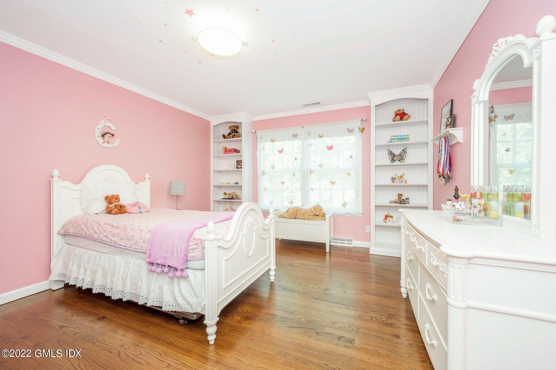 12 Frontier Road Cos Cob, CT 06807 - Photo 18 of 36 a bed room with a bed and a couch