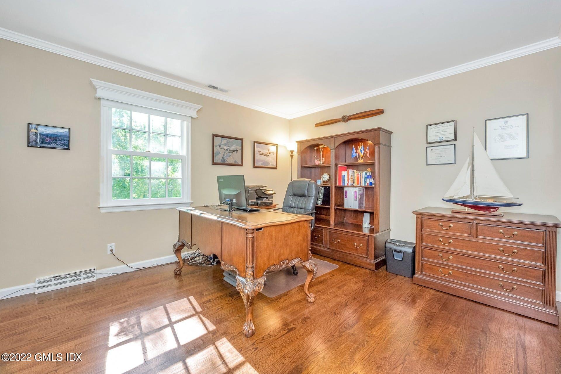 12 Frontier Road Cos Cob, CT 06807 - Photo 19 of 36 a room with a window and a table in it