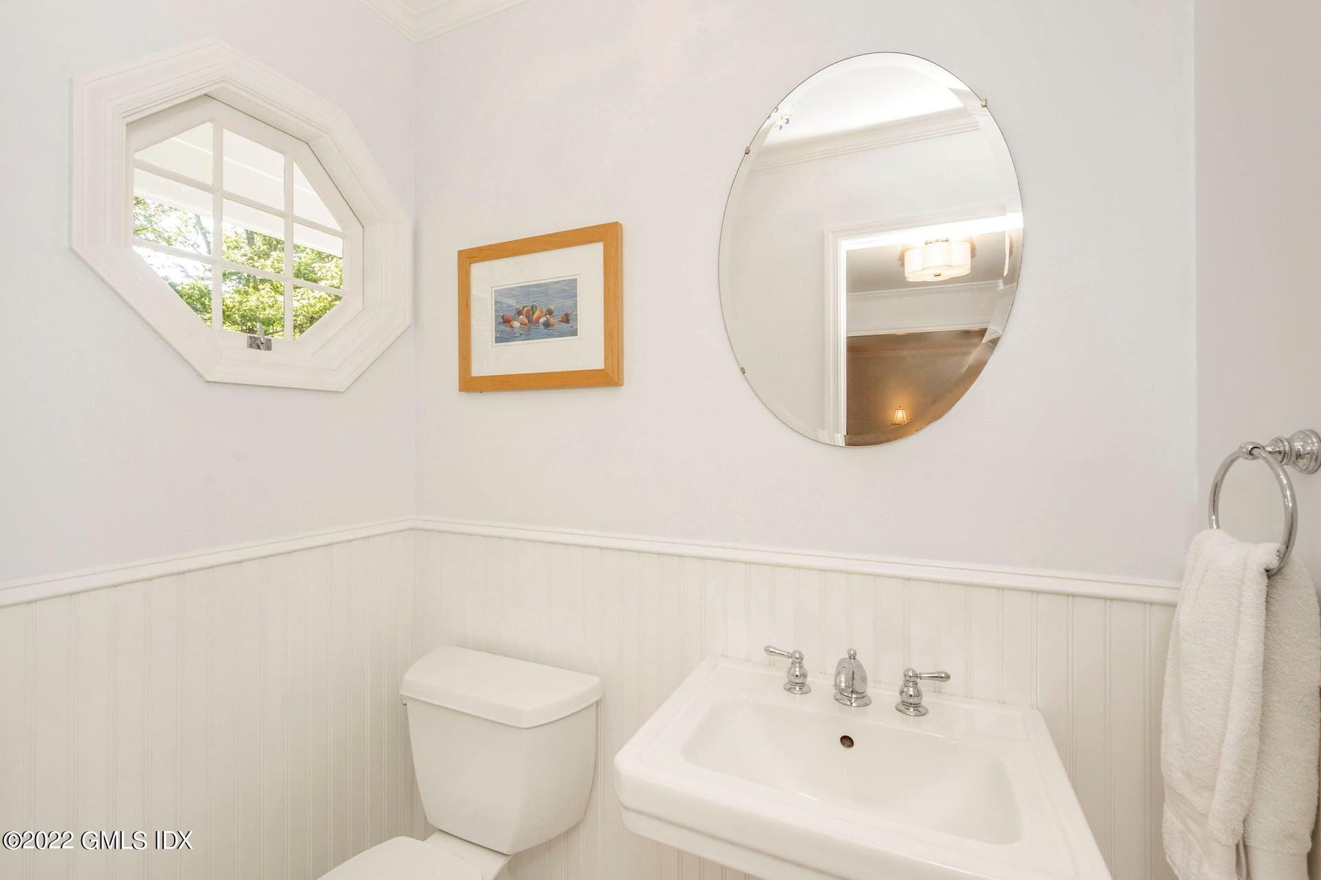 12 Frontier Road Cos Cob, CT 06807 - Photo 20 of 36 a bathroom with a toilet and a sink
