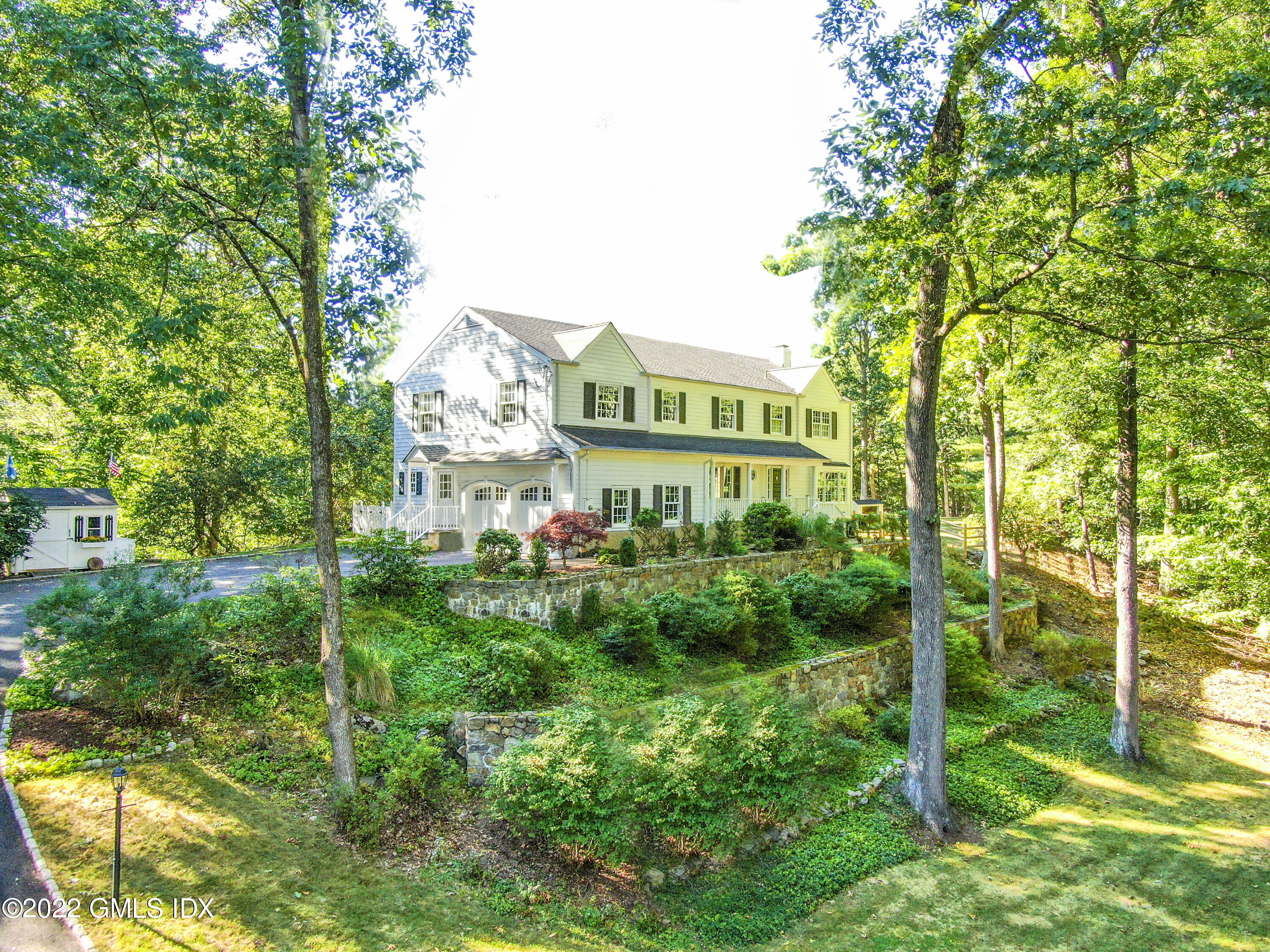12 Frontier Road Cos Cob, CT 06807 - Photo 2 of 36 a view of a building with a yard