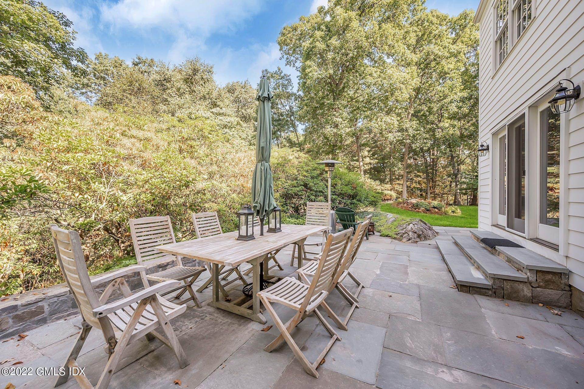 12 Frontier Road Cos Cob, CT 06807 - Photo 28 of 36 a view of a patio with table and chairs and potted plants