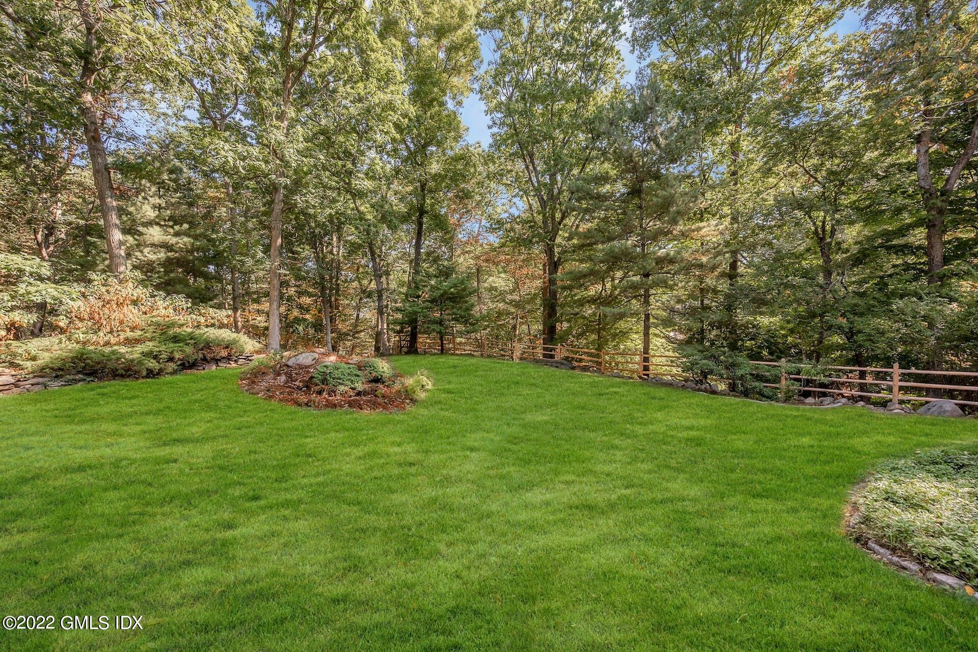 12 Frontier Road Cos Cob, CT 06807 - Photo 29 of 36 a view of a field of grass and trees